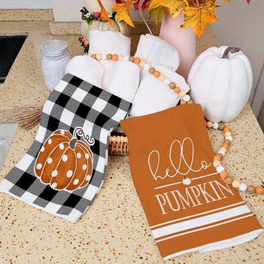 Set of 2 kitchen towels measuring 45.72*66.04 cm featuring autumn pumpkin elements for home decor. These reusable towels are perfect for parties, holiday decorations, and make a great gift. The design includes a black buffalo plaid polka dot pumpkin