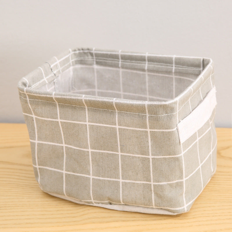 Waterproof desktop storage box made of printed cotton and linen with handle, suitable for organizing sundries.