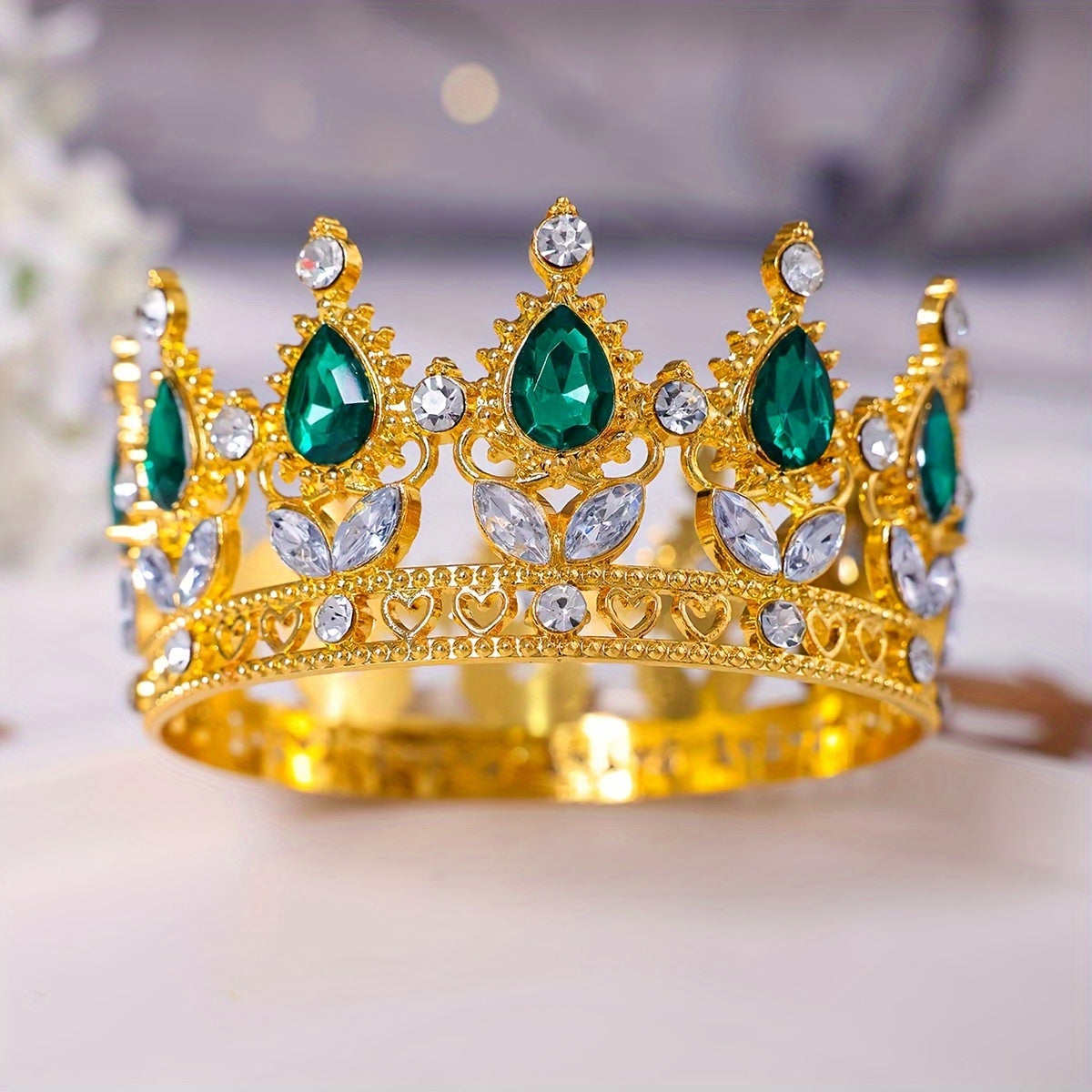 This stunning Baroque style bridal tiara features intricate golden water diamond embellishments, making it ideal for beauty pageants, proms, and formal events. Adorned with delicate flowers in a beautiful full circle design, this tiara is perfect for