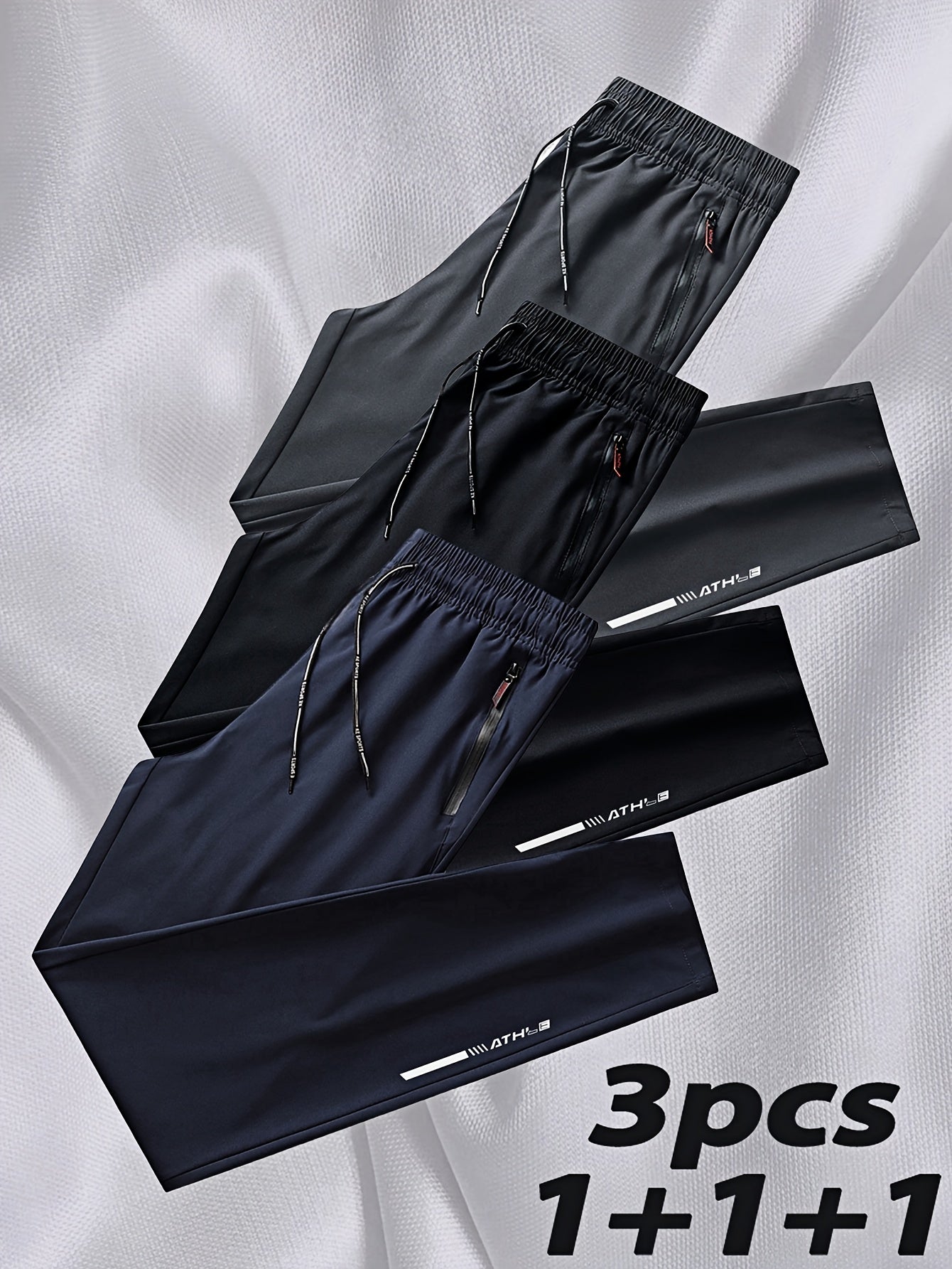 Men's 3-pack casual running pants made from 100% polyester non-stretch woven fabric. Features regular fit with zipper details, print pattern, and summer breathable quick-dry design.