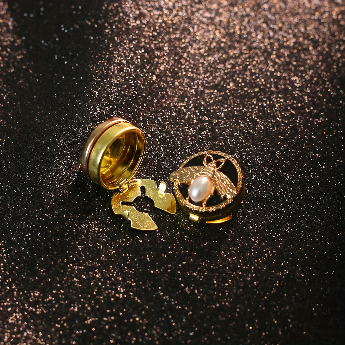 Get a pair of elegant Golden Bee cufflinks and shirt buttons set for a fashionable and seamless look. Made of shiny copper, these clip-on buttons are perfect for formal tailcoat attire and add a touch of luxurious decoration to your clothing. This fancy