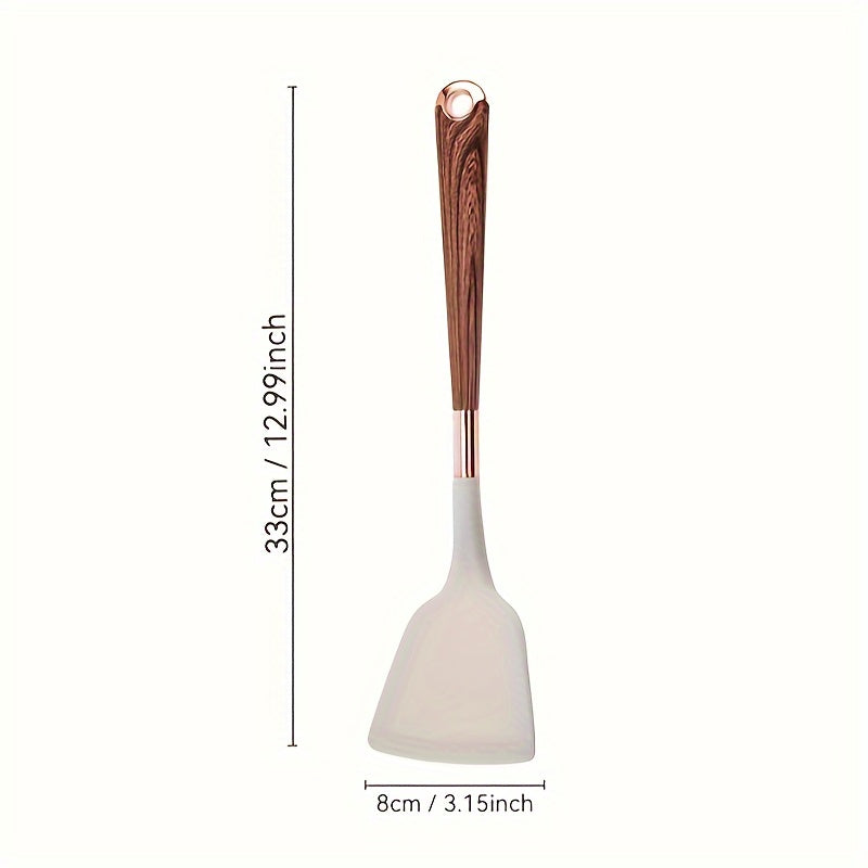 Essential for home chefs, this premium silicone spatula features a stylish wood grain handle. Heat-resistant, non-stick safe, and perfect for cooking and baking.