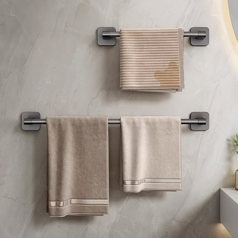 Wall-mounted towel rack for bathroom made of durable space aluminum and plastic. Easy installation with no drilling required. Single rod design for organizing towels.