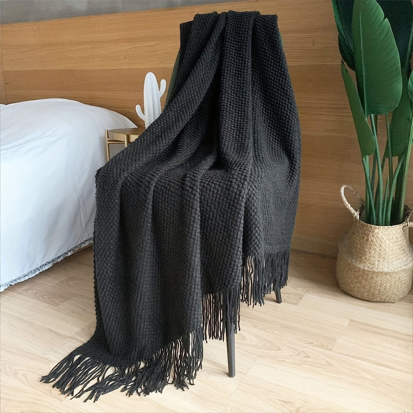 Stay cozy and stylish with this elegant knit throw blanket, featuring tassels for added flair. Made of lightweight acrylic with a bubble textured design, this blanket offers all-season comfort. Perfect for use on the couch, bed, or as home decor, as well