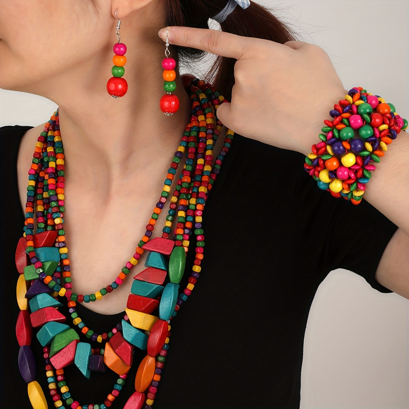 Handmade jewelry set featuring colorful wooden beads in an exaggerated multi-layer design, including 4 pieces of earrings, a necklace, and a bracelet. Perfect for adding a stunning touch to party outfits.