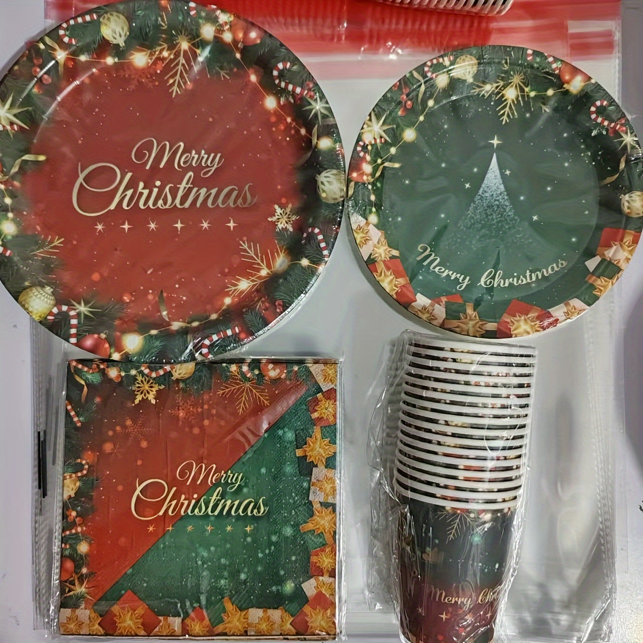 80 pieces of red and green Christmas party supplies including merry Christmas paper plates, napkins, cups, and tableware set. Christmas tree dinnerware set for holiday parties and Christmas party decorations.