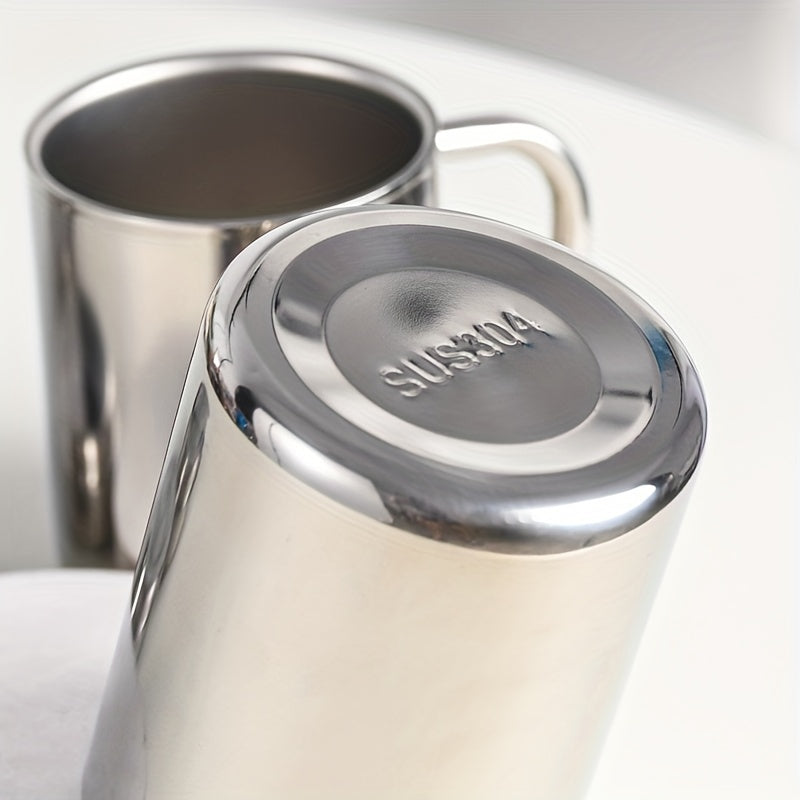 Stainless steel coffee mug with lid, double-wall insulation, versatile drinkware, ideal gift.