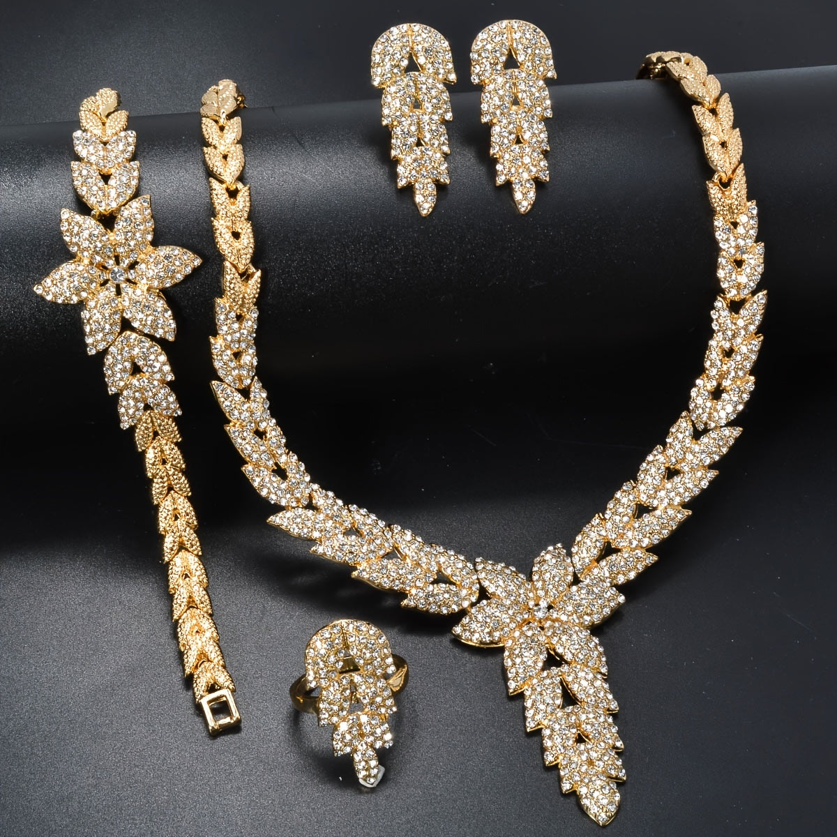 Get the ZEADEAR Luxury Elegant Flower Theme Jewelry Set for Weddings and Special Occasions, featuring high-quality -Plated Copper and Sparkling zirconia. This stunning set includes 1 Necklace, 1 Bracelet, 1 Ring, and 1 Pair of Earrings.