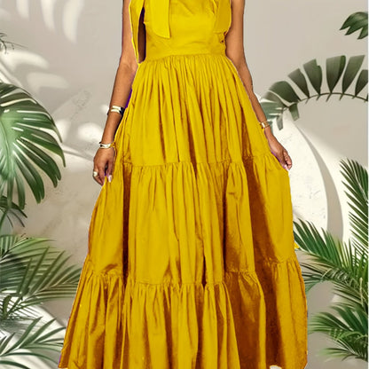 Stylish summer maxi dress for women with bow tie straps, cinched waist, solid color, and machine washable.