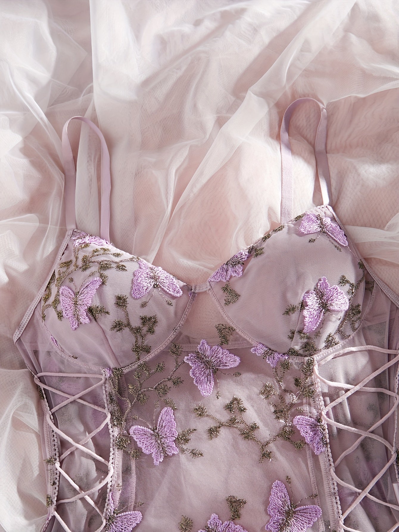 Purple butterfly embroidered teddy bodysuit with deep V-back, thong bottom, sheer mesh, hand washable, for women.