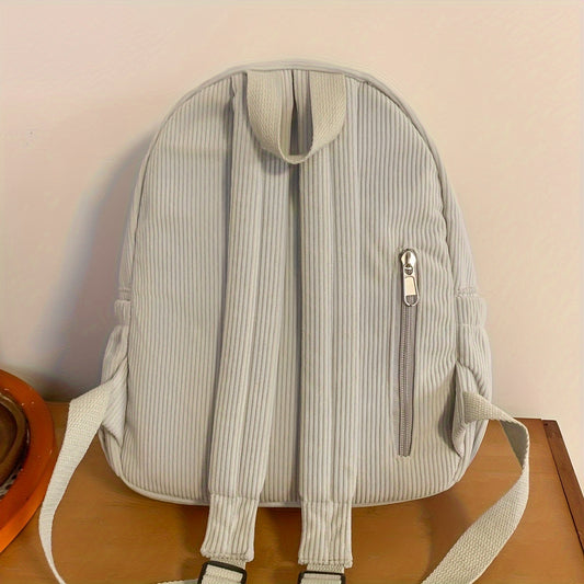 Small corduroy fashion backpack for women in black, with adjustable straps and zipper closure