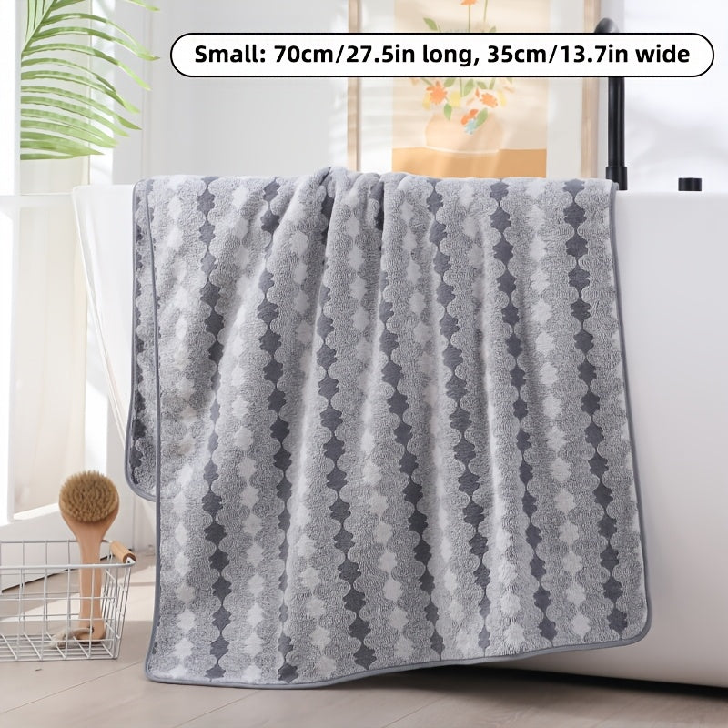 One set of extra large and small bath towels for women made of super soft, absorbent coral velvet with a modern design and strong absorbency.