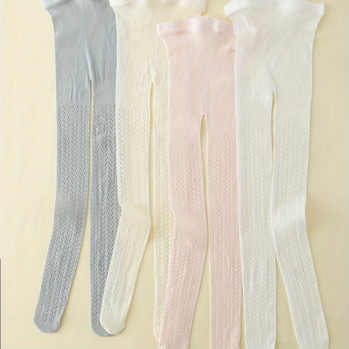 4 pairs of girls' solid mesh pantyhose for comfortable outdoor fashion wear in all seasons.