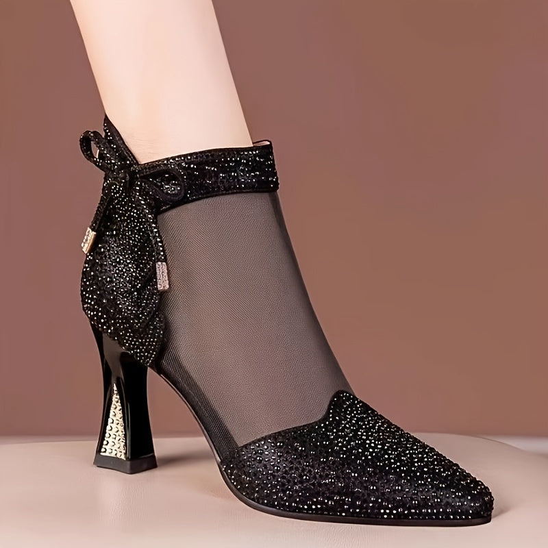 Stylish mesh ankle boots for women with pointed toe, rhinestone bow detail, chunky heel, hollow-out design, and back zipper.