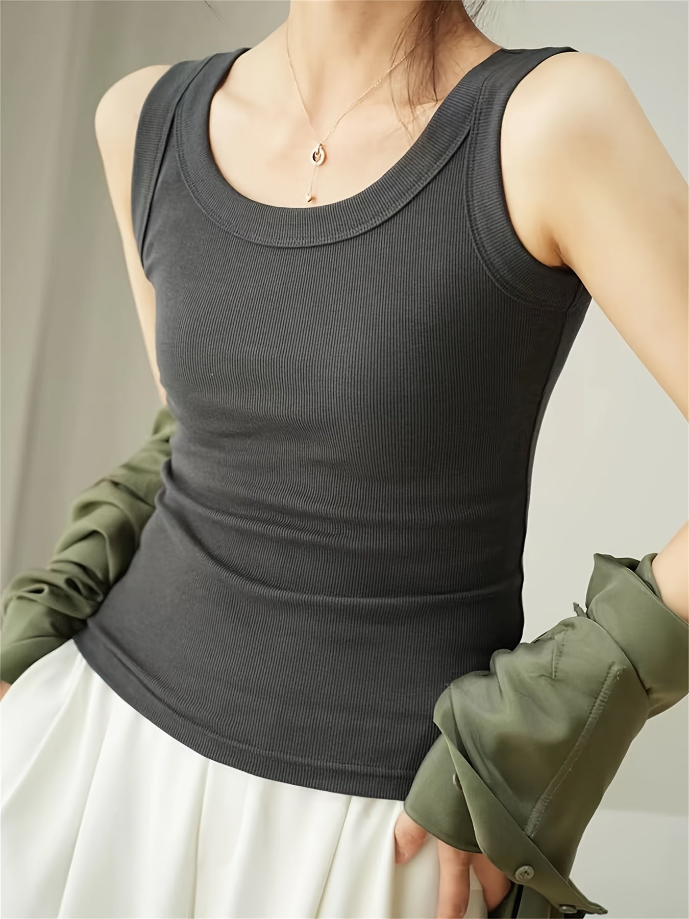 Set of 4 U-neck camisole vests for women, perfect for spring/summer. Can be worn as an outer layer or as a sleeveless base shirt. Features low neckline for breathability and comfort.