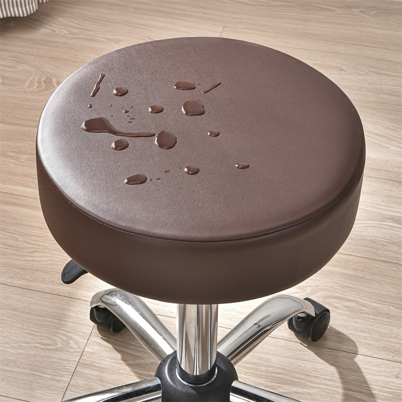 Waterproof faux leather stool cover in black, red, and brown. Elastic fit for various settings. Machine washable.