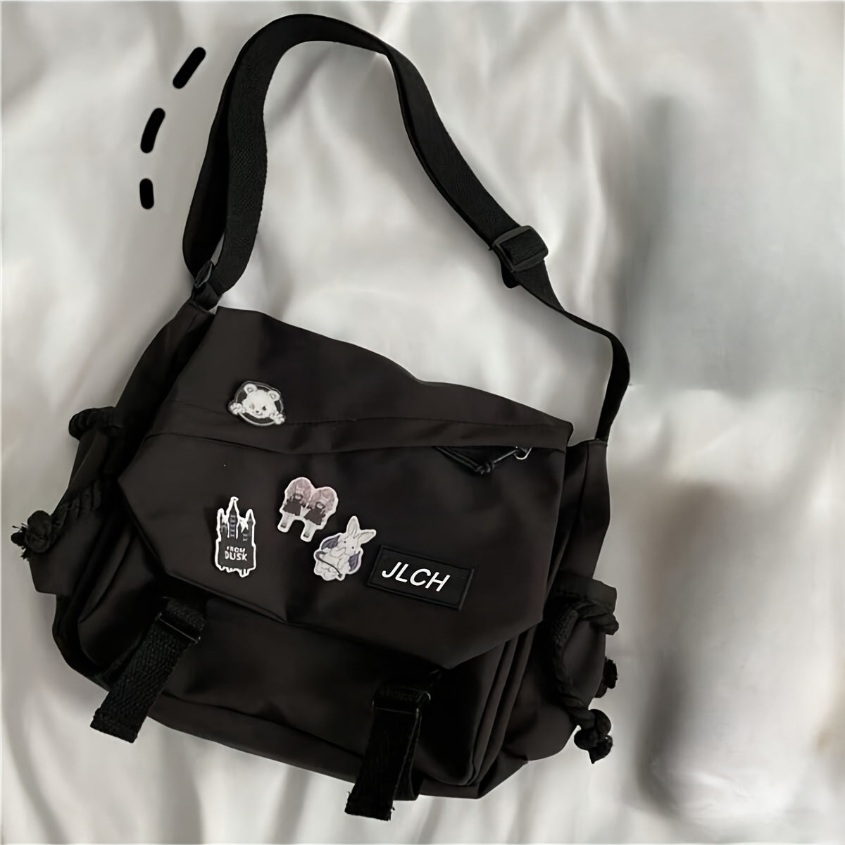 Adjustable unisex shoulder bag in white, pink, blue, or black, suitable for school, travel, and everyday use with a stylish and functional design.