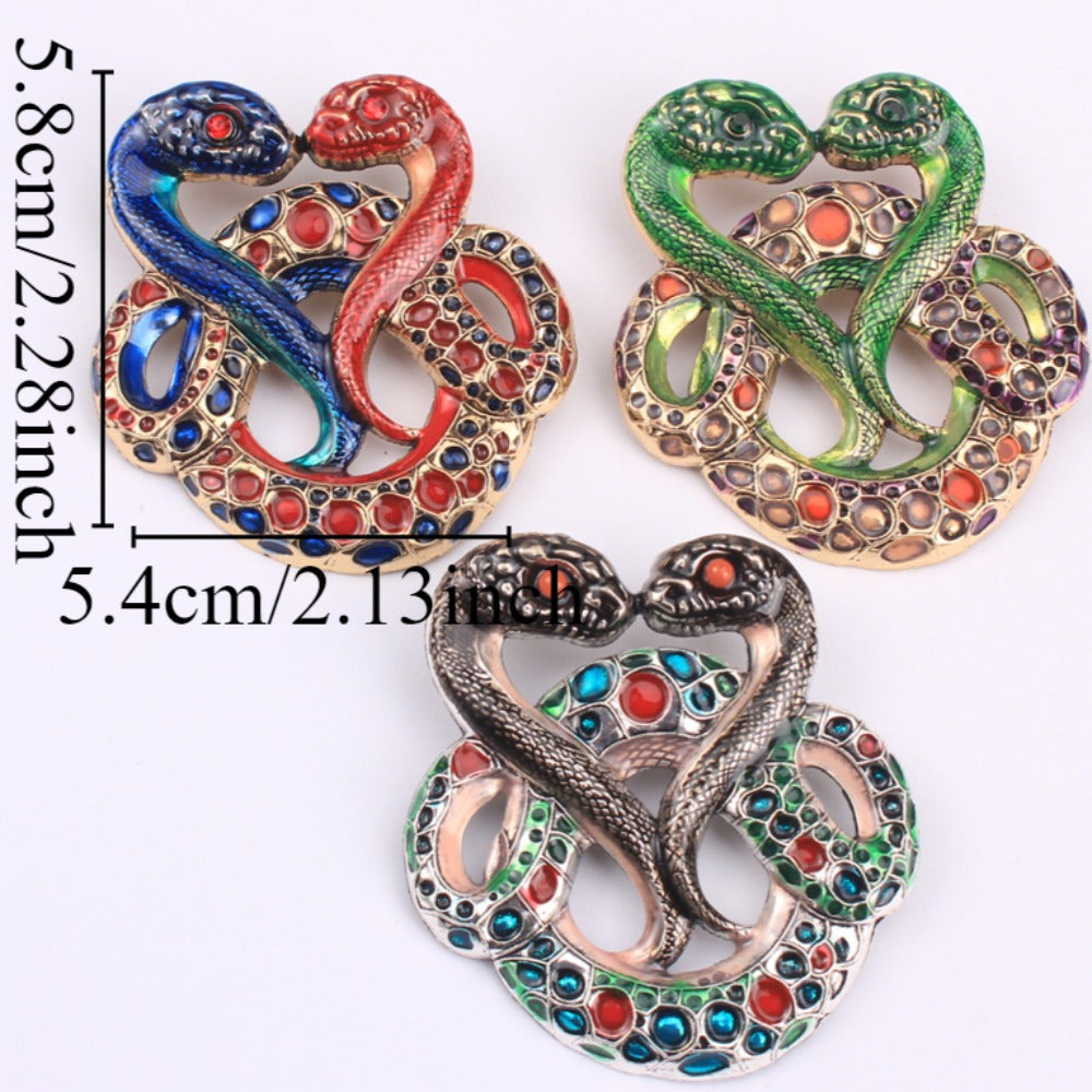 Luxurious and elegant, this rhinestone-adorned two-headed snake brooch features an irregular zodiac shape. With its unique and eye-catching design, this novelty accessory is the perfect addition to any woman's fashion collection. Ideal for adding a touch