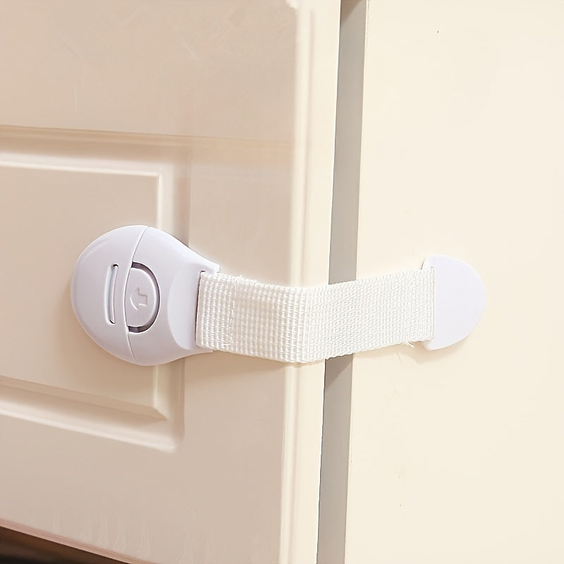 A set of 10 white plastic safety cabinet locks with adjustable childproofing straps, easy installation, tamper-resistant design, lead-free materials, suitable for securing drawers and doors for home security.