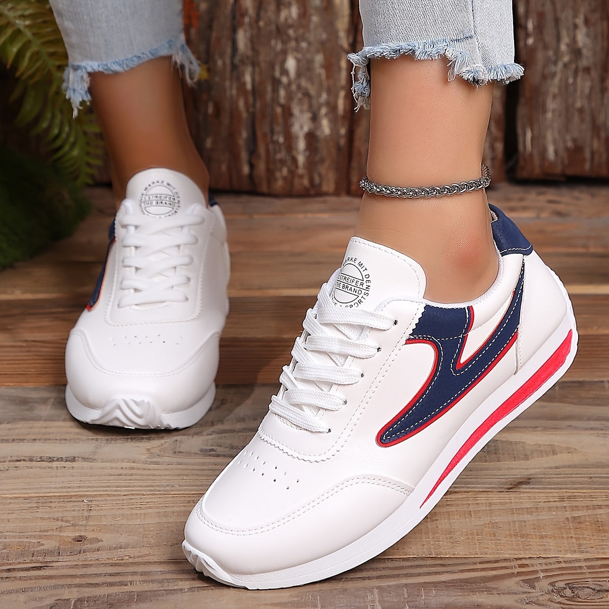 Women's flat lace-up sneakers for outdoor casual wear, comfortable low top shoes.