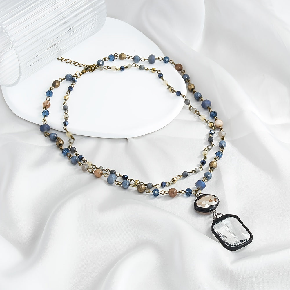 New tribal style necklace featuring two layers of natural stone crystals and glass chains, with a square glass pendant designed for daily wear by both men and women during the spring and summer seasons.