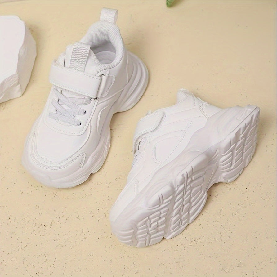 White unisex running sneakers for youngsters with hook-and-loop closure, soft EVA sole, geometric design, ideal for outdoor activities and casual wear.