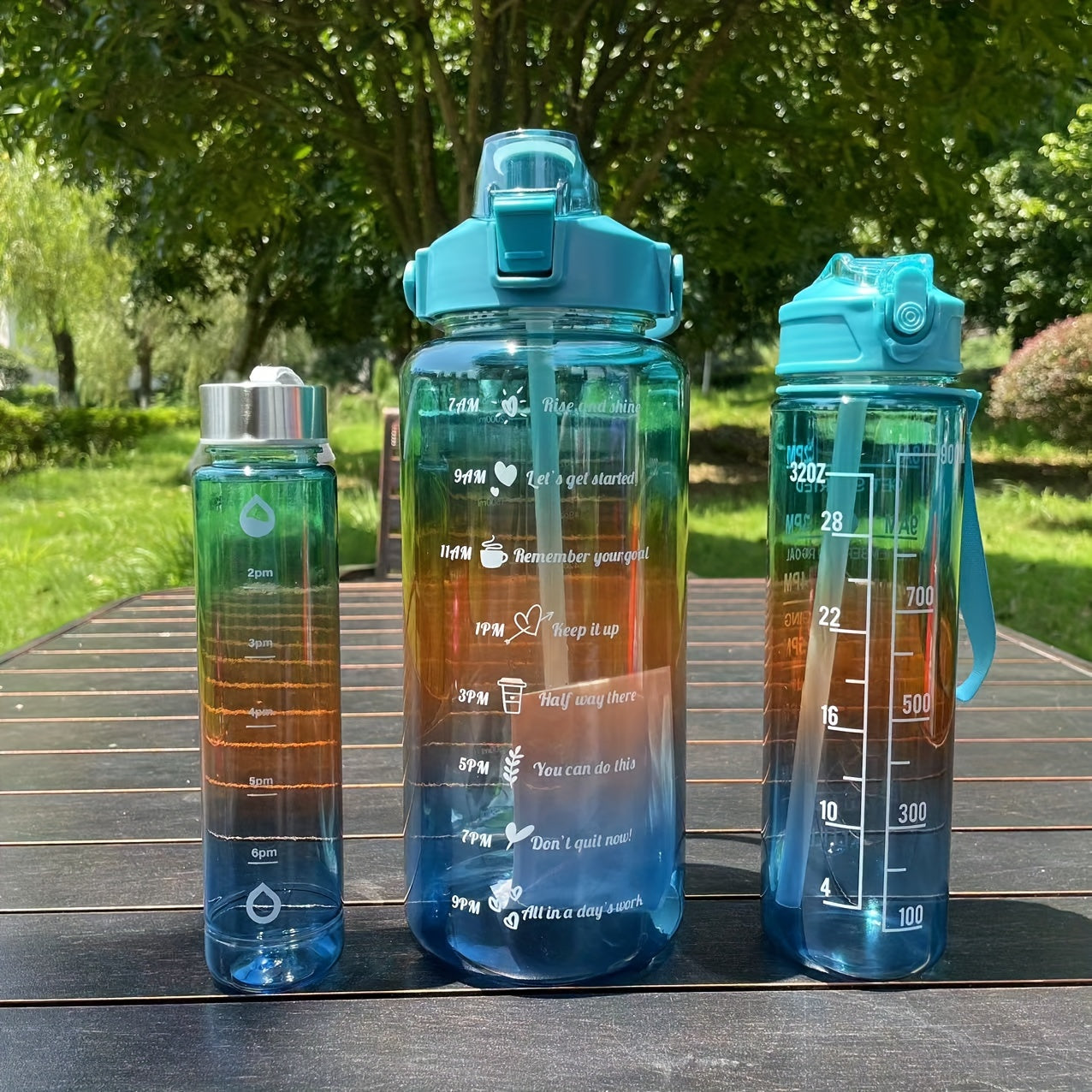 Set of 3 gradient color motivational water bottles (64oz, 32oz, 15oz) with mobile phone holder, food grade material straw cup, 2 stickers. Perfect for home and outdoor use, ideal Christmas gift.