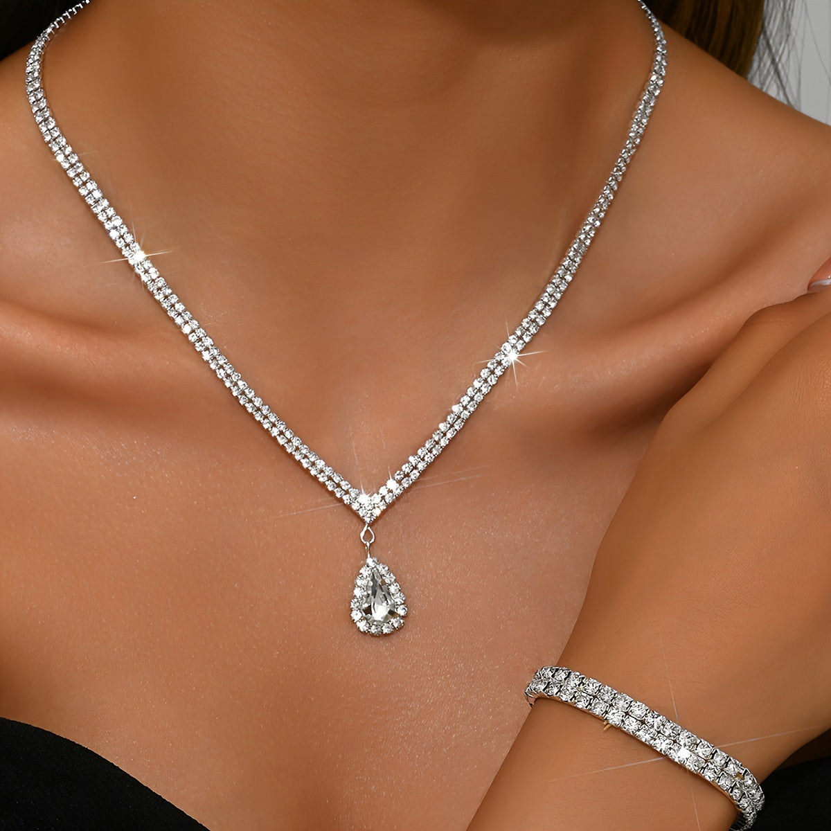 This exquisite collection features luxurious women's jewelry adorned with shimmering water diamonds, including a stunning necklace, elegant earrings, and a versatile stretch bracelet. Perfect for adding a touch of glamour to any party or dance.