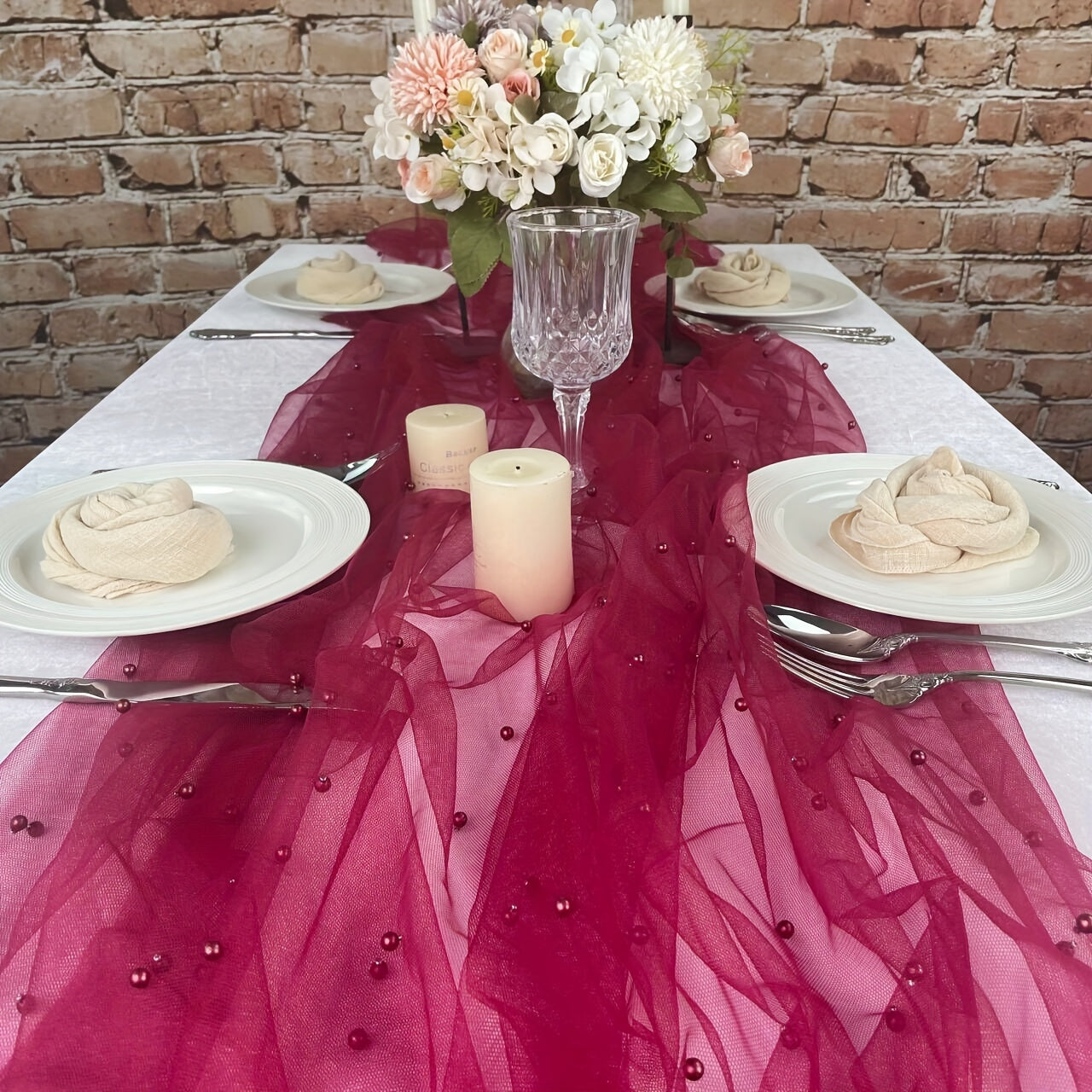 Elegant pearl bead tulle table runner, perfect for weddings and parties. Can also be used as a chair sash or backdrop drape. Made from 100% polyester fabric with delicate bead detailing.