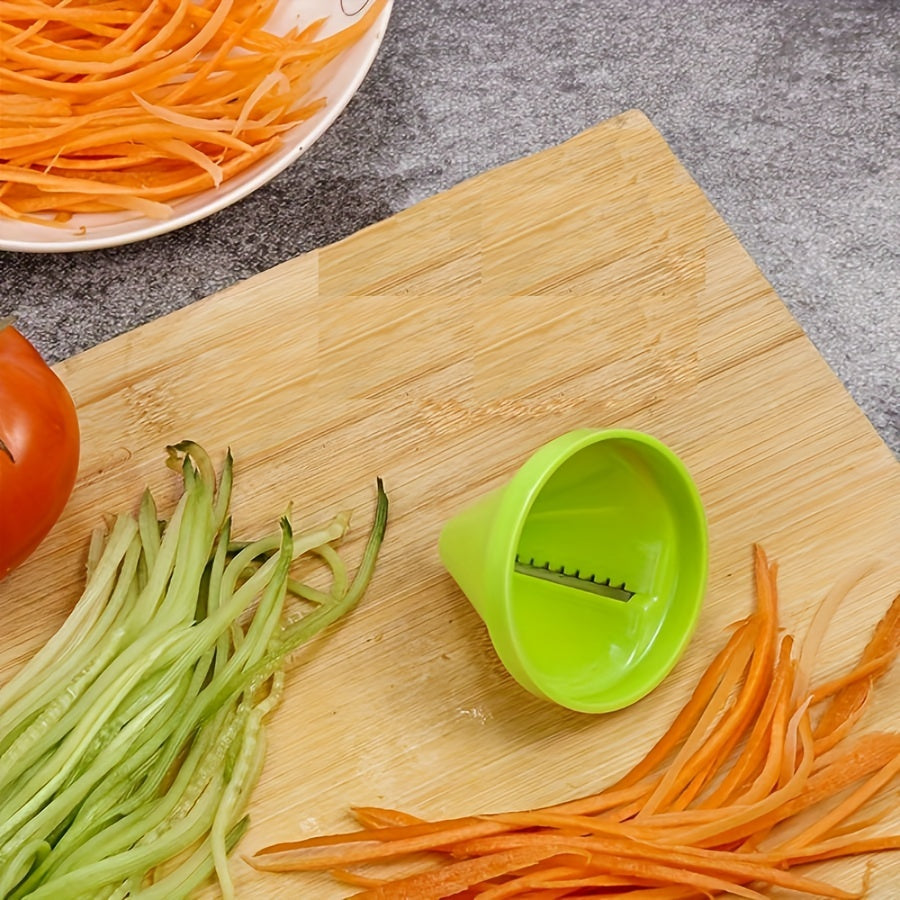 Multifunctional kitchen spiralizer for making zucchini noodles and grating vegetables easily. Durable plastic in green color.