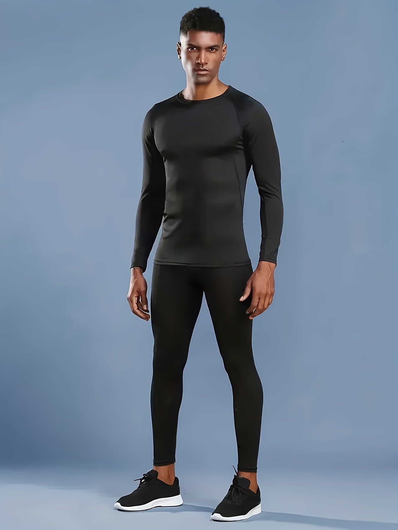 Set of 2 men's athletic underwear with high stretch polyester fabric in solid color. Includes long sleeve compression shirt and leggings for running, basketball, training, and outdoor