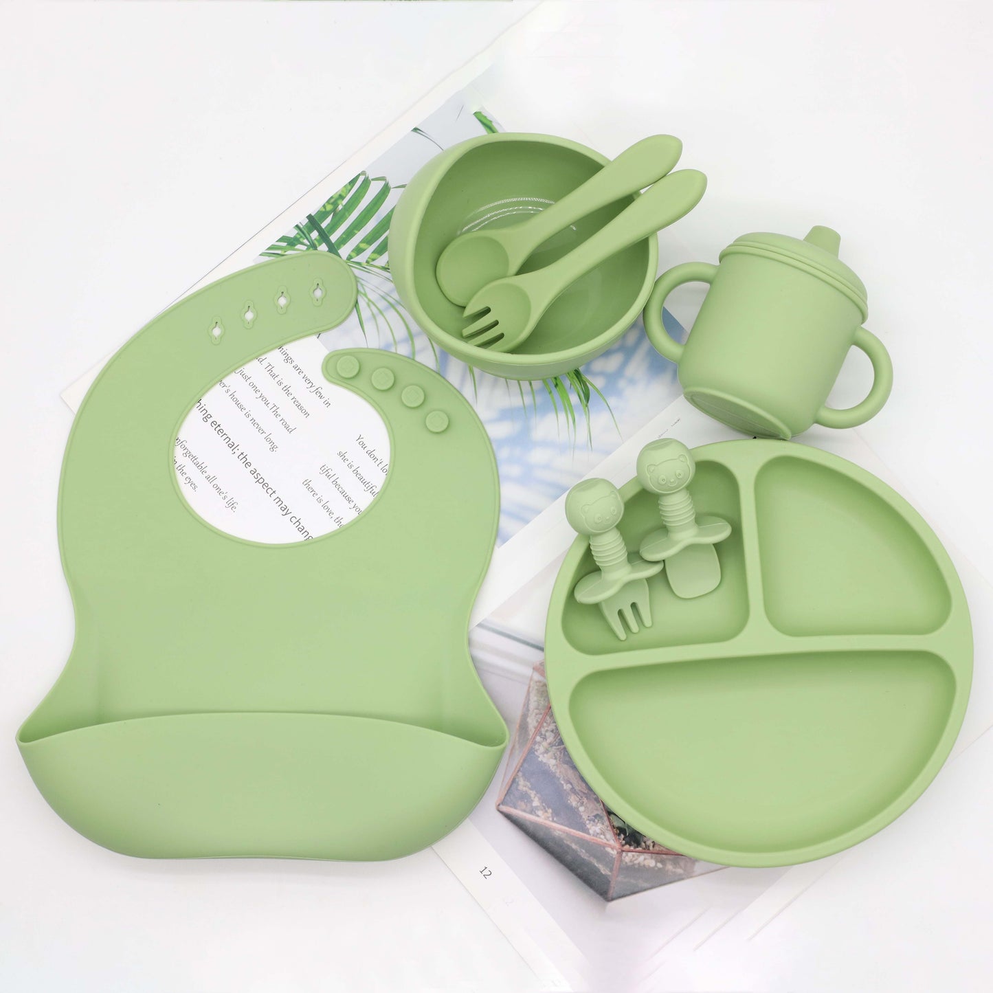 Set of 8 pieces of food grade silicone tableware including a feeding bib, plate, bowl, cup, silicone spoon, fork, and short spoon fork set. Perfect for gifting on Christmas, Halloween, Thanksgiving Day, New Year's, Valentine's Day, and Easter.