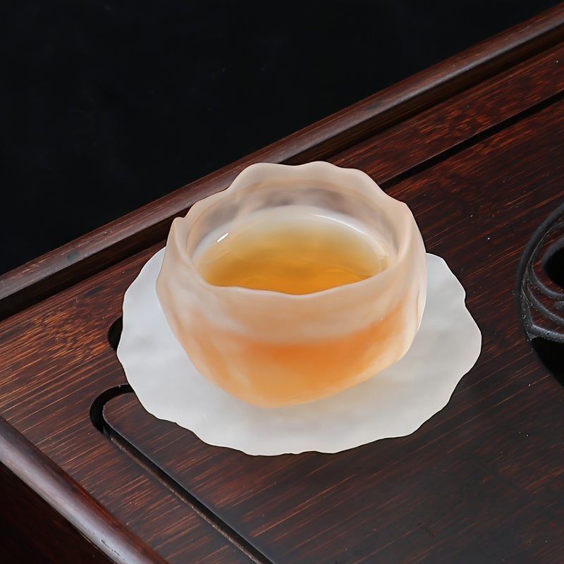 Irregular glass tea cup set with cup mat, perfect for hot drinks and a great gift for the holidays.