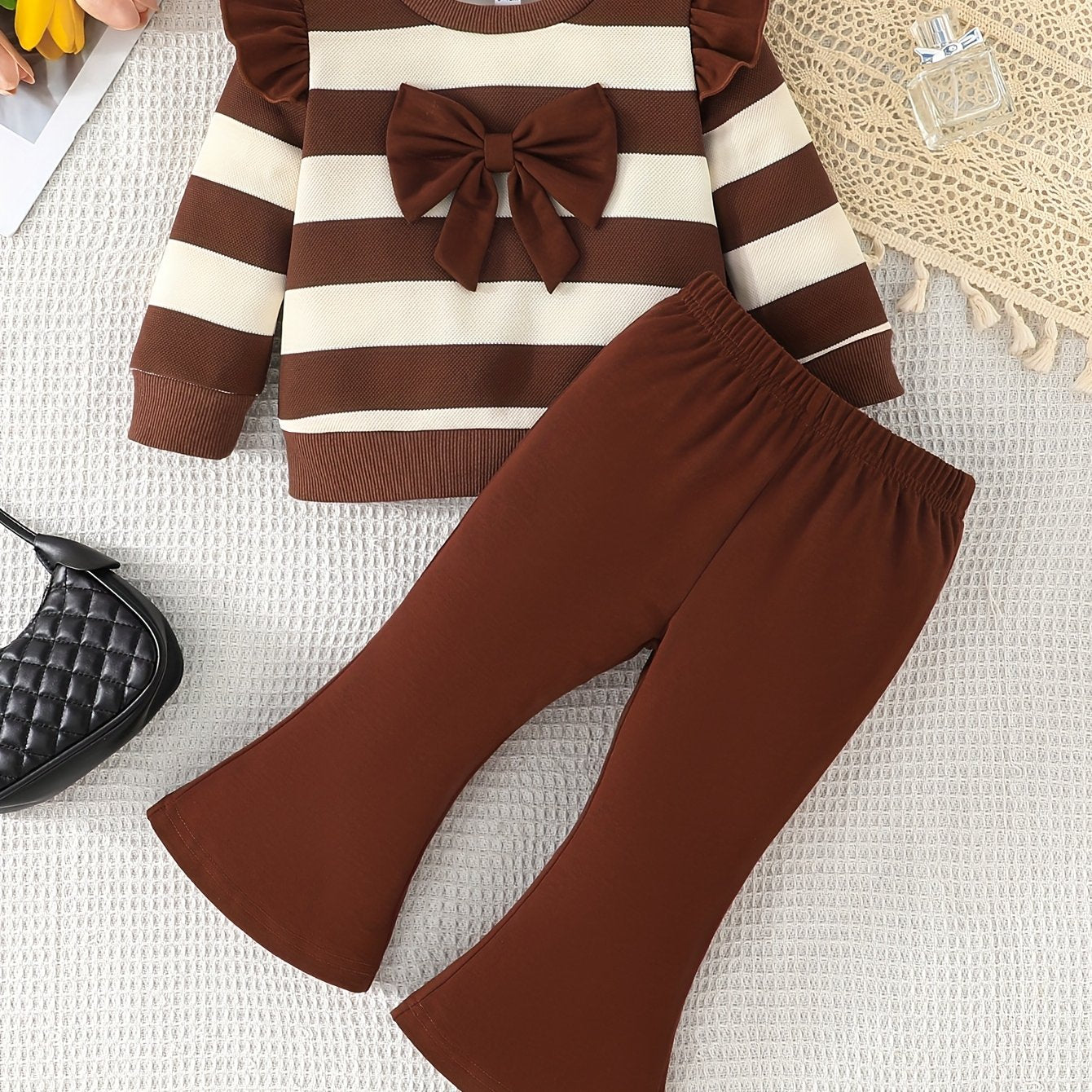 Stylish girls' casual outfit with striped top and matching bell pants, great for outdoor activities in spring and autumn.