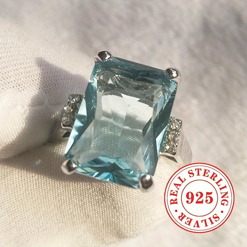 Simple yet elegant, this classic 1 Lady Anniversary Ring features a 5.4g S925 Sterling Silver band with a 4 prong-set square Aquamarine synthetic gemstone. Perfect for everyday casual wear or special occasions like weddings, banquets, and parties, this