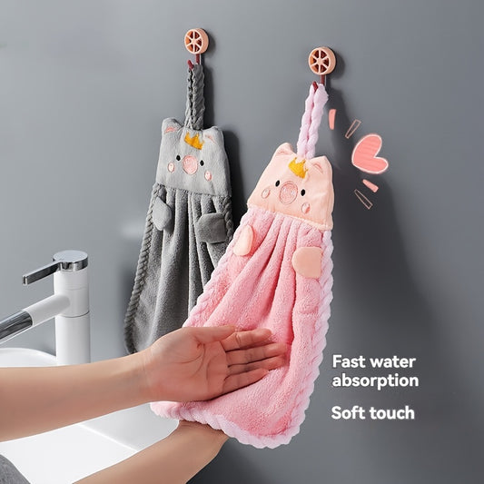 Absorbent hand towel with non-shedding cartoon pig design, made of coral velvet. Perfect for kitchen, bathroom, and living room use.