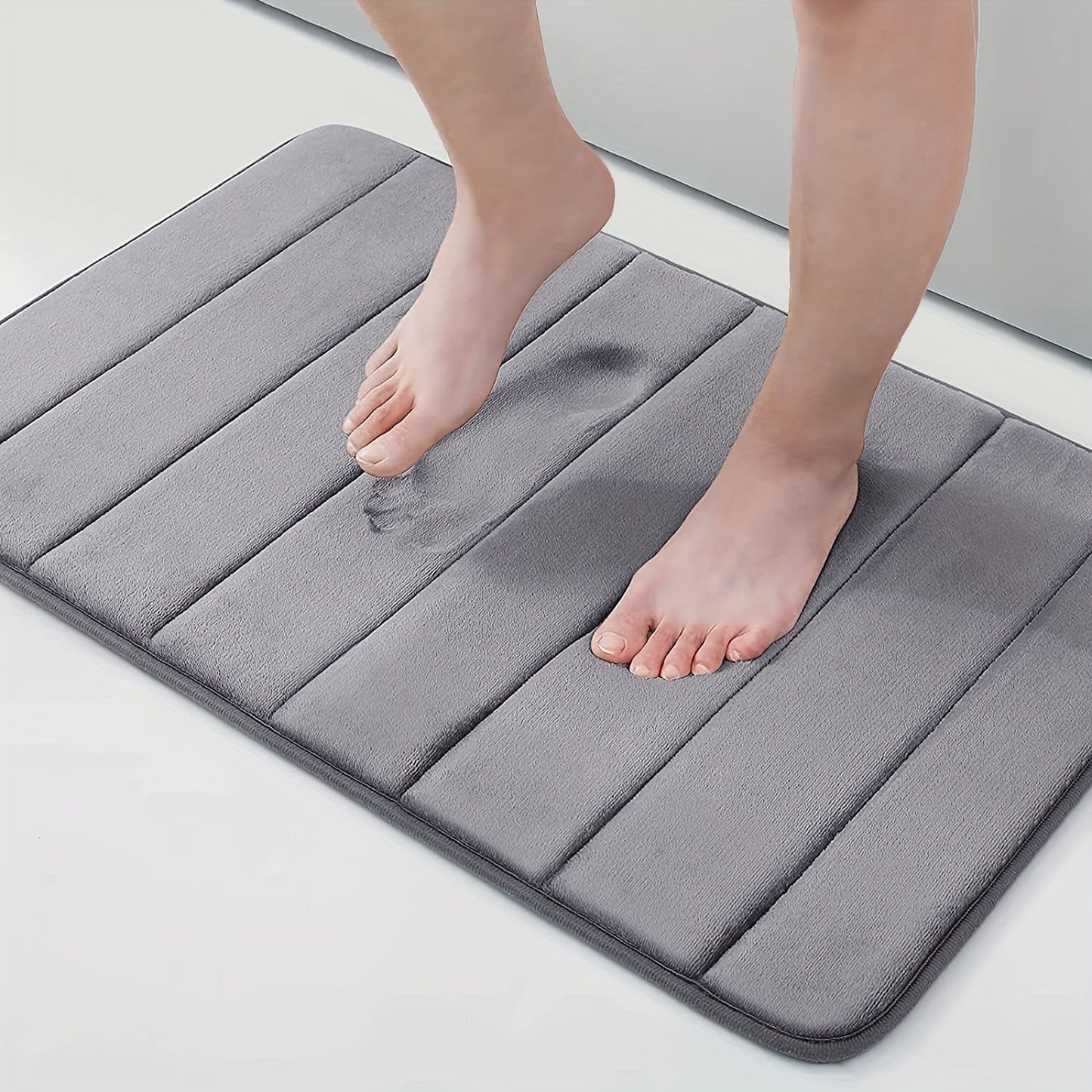 1 piece of Memory Foam Bath Mat designed for the bathroom, featuring a non-slip surface and thickened soft material that quickly absorbs water and dries fast. This machine-washable mat can also be used as a shower mat, living room or bedroom entrance