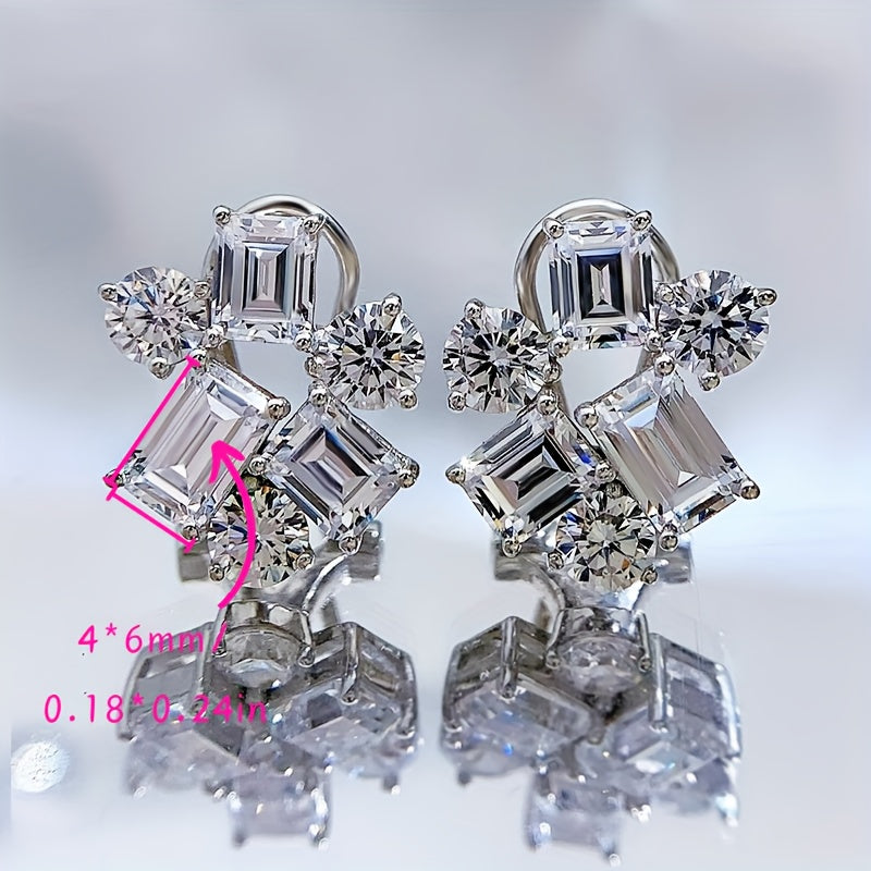 Included in the Christmas gift box are 925 sterling silver stud earrings featuring synthetic gemstones in a cluster design. These luxury and elegant earrings have no plating and are perfect for a holiday theme. The ear needle material makes them ideal