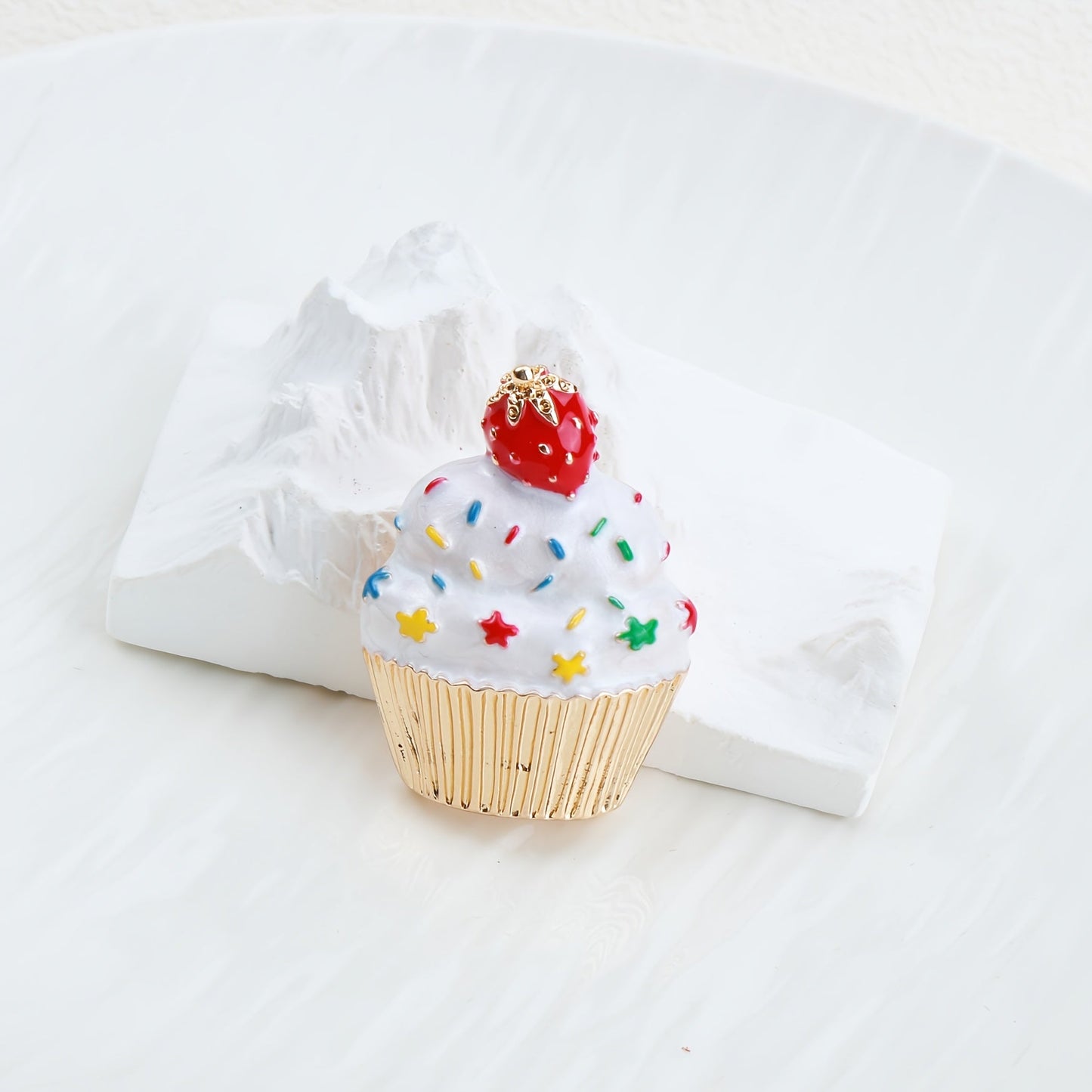 Add some festive flair to your holiday outfits with this adorable Cute Christmas Cupcake Brooch Pin. Crafted from enamel, this accessory is the perfect way to spread holiday cheer wherever you go.