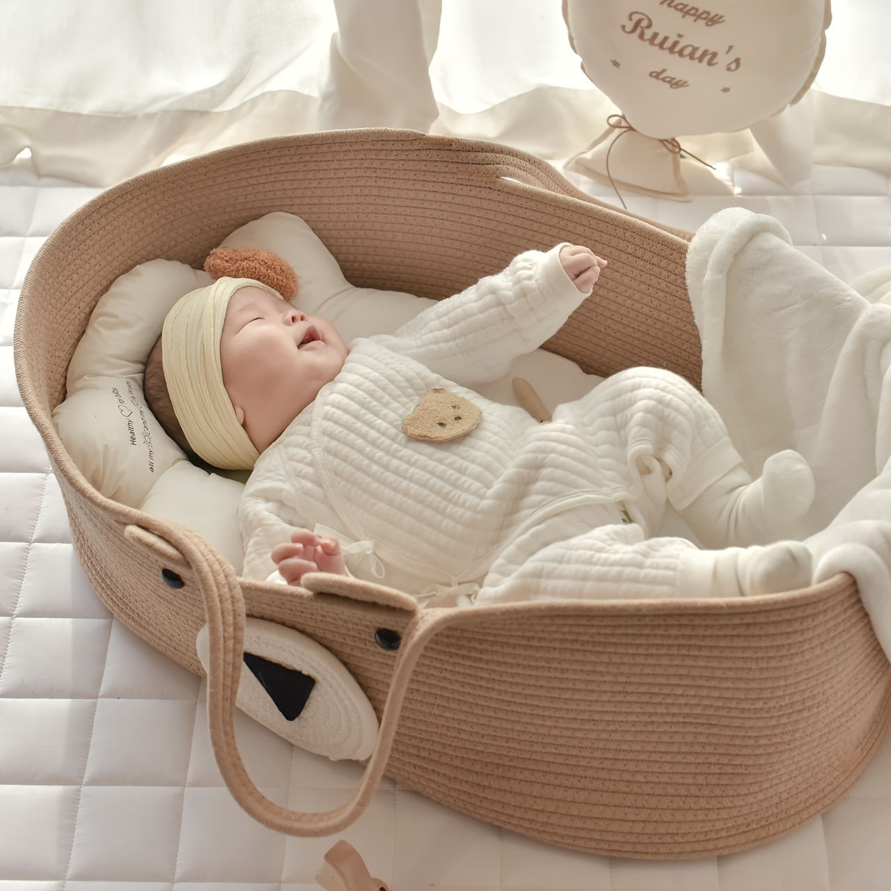 The LA DEARCHUU Portable Baby Crib features a charming Bear Design and a Foldable Fabric Cradle. It also includes a Multifunctional Weaving Storage Basket in Beige/Khaki. This product does not require batteries and is suitable for Newborns up to 3 years