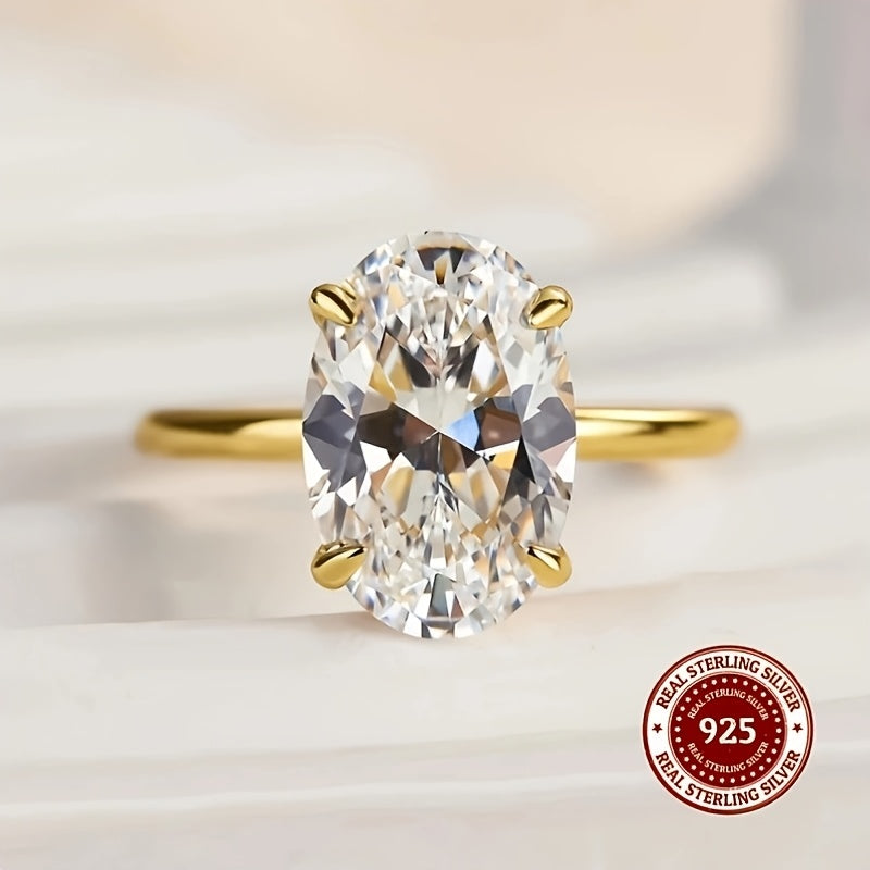 Luxurious minimalist ring made with 925 sterling silver featuring an oval cut synthetic zirconia in a claw setting. Available in 1CT, 2CT, or 3CT options for both weddings and daily wear. Weighing 2.5g, this ring is adorned with a simulated diamond for a