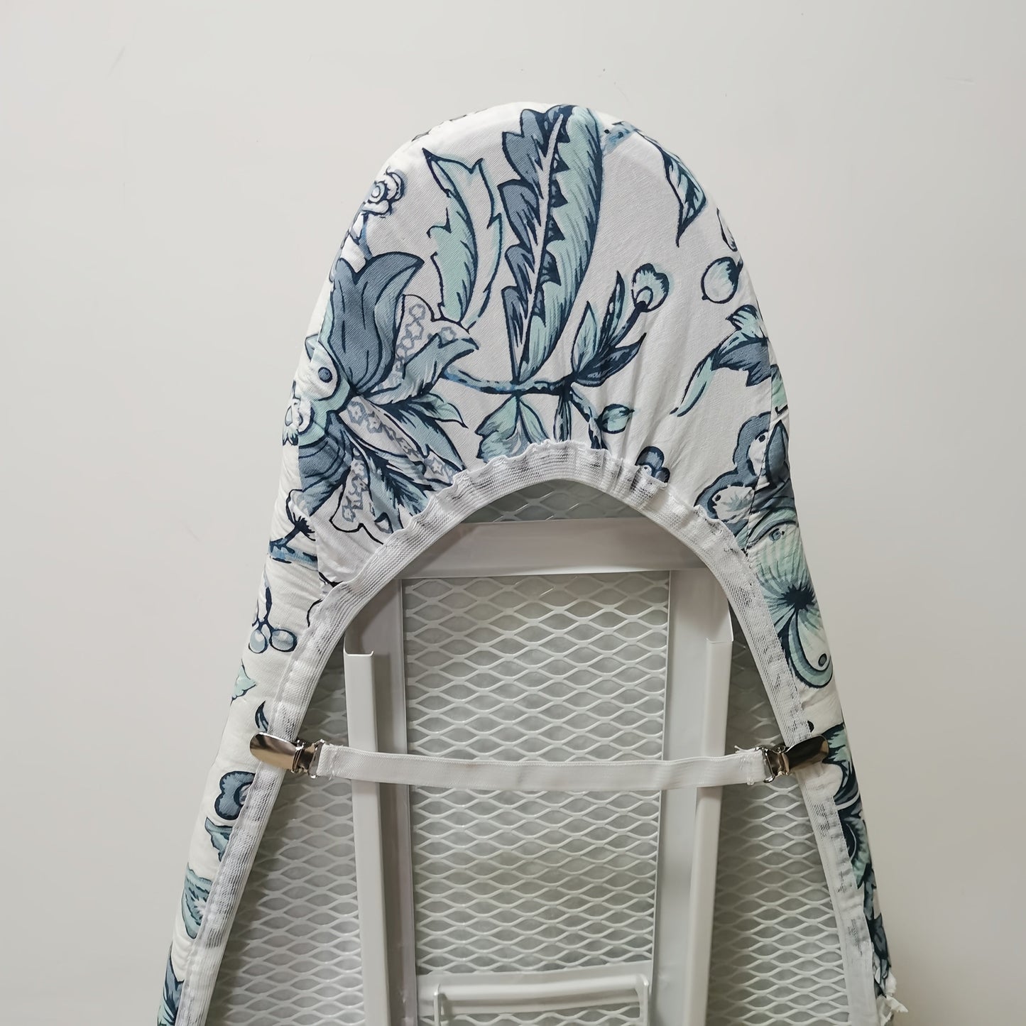 Ironing becomes a breeze with our Extra Thick Classic Ironing Board Cover. Made with durable plastic, this cover comes with a liner and elastic edges for a perfect fit. Say goodbye to power cords - the elastic back and buckle make it easy to secure in