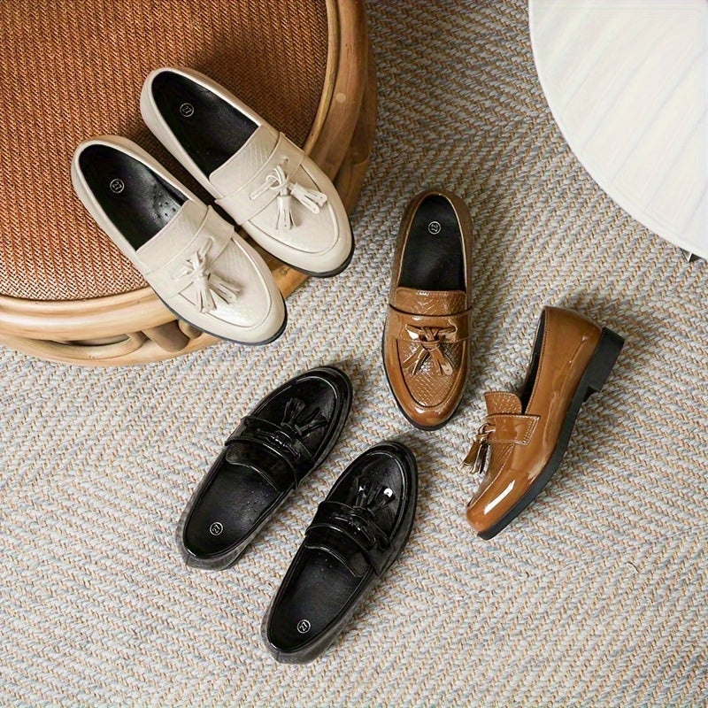 Men's casual loafers in black with non-slip TPR sole, lightweight slip-on design, tassel detail, and versatile for indoor and outdoor wear.