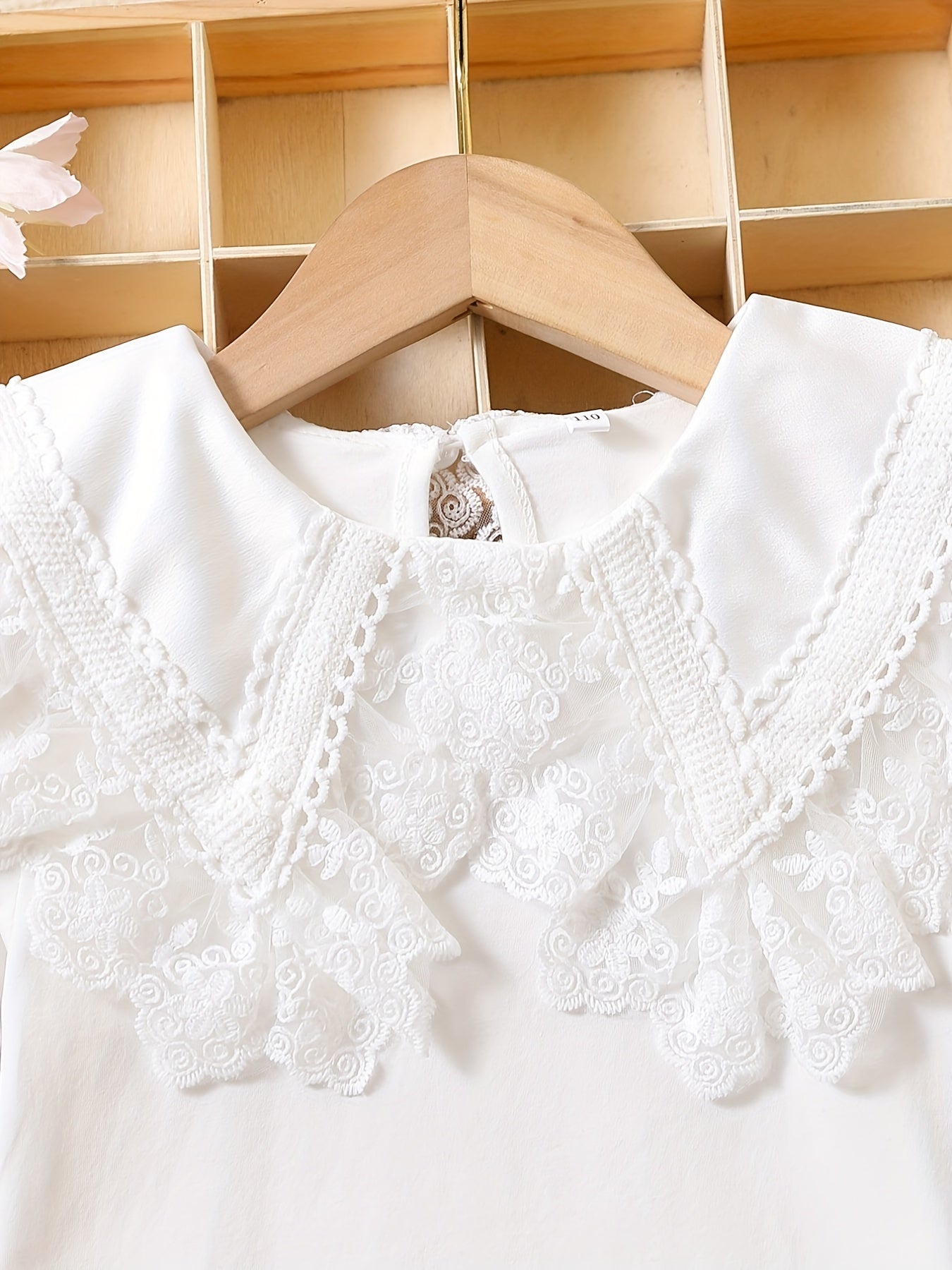 Girls' cotton knit T-shirt with lace collar detail, ideal for summer. Stretchy, breathable, and machine washable.