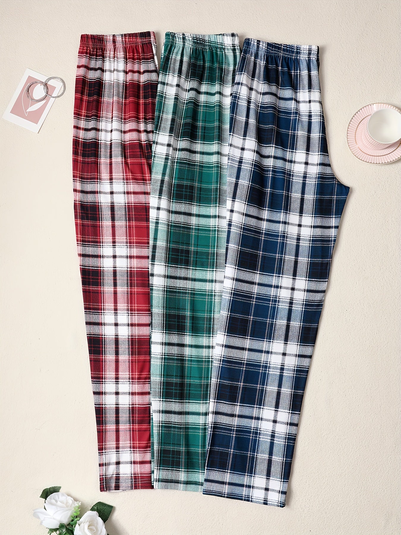 3-pack of men's plaid pajama pants with comfortable medium stretch knit fabric in assorted designs.