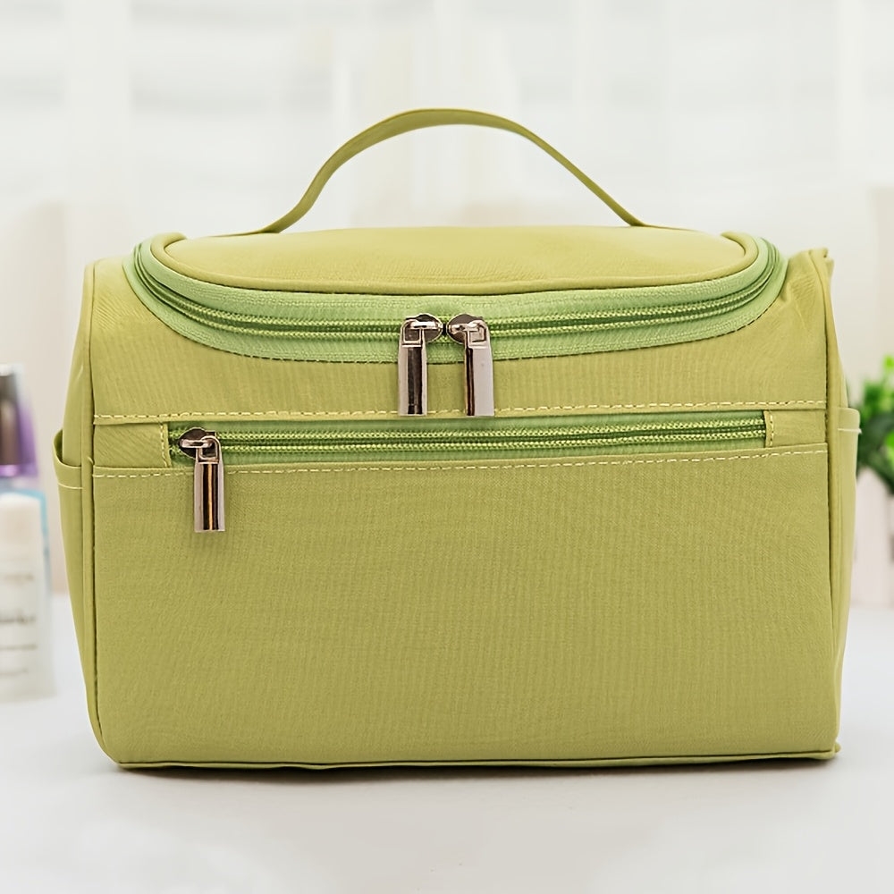 Spacious waterproof travel toiletry bag with zipper for men and women, made of durable Oxford fabric.