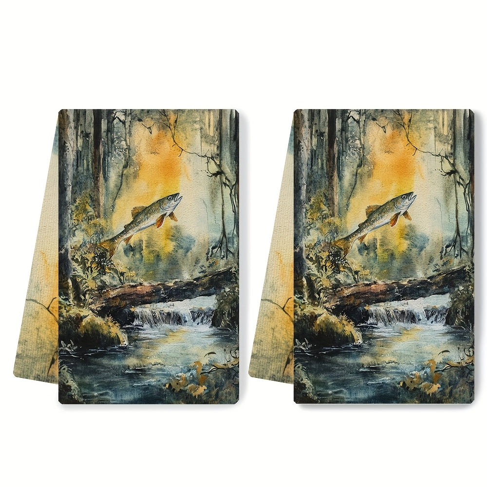 Two pieces of ultra soft kitchen towels featuring a serene forest stream and salmon jump design. These highly absorbent towels are machine washable and perfect for drying dishes or hands. With a contemporary style, each towel measures 40.64x60.96 cm.