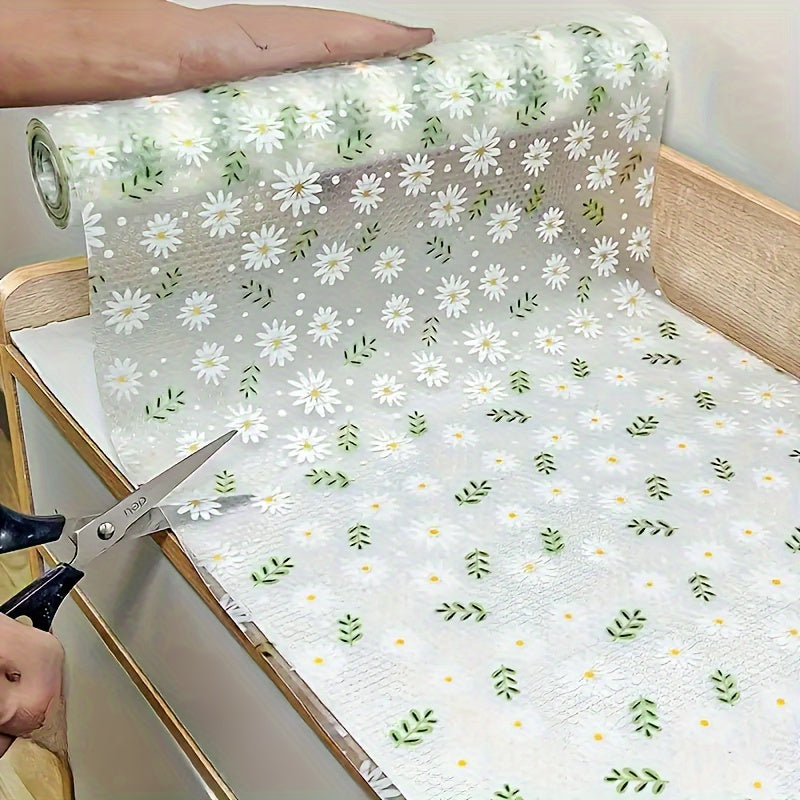 Modern floral pattern EVA shelf liner in daisy print. This non-adhesive, non-slip drawer mat is made of durable rubber and is perfect for protecting cabinets in the kitchen, refrigerator, or desk storage.