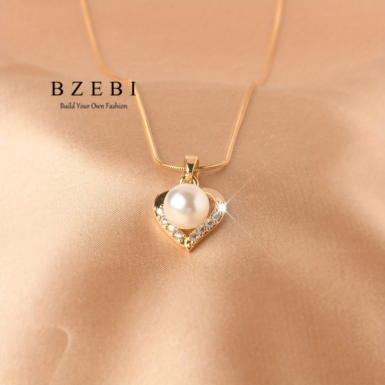 Set of four elegant jewelry pieces made of titanium and 18k gold plated, including earrings, necklace, and ring. Features a cute heart design with inlaid milky stone and shining zirconia stones.