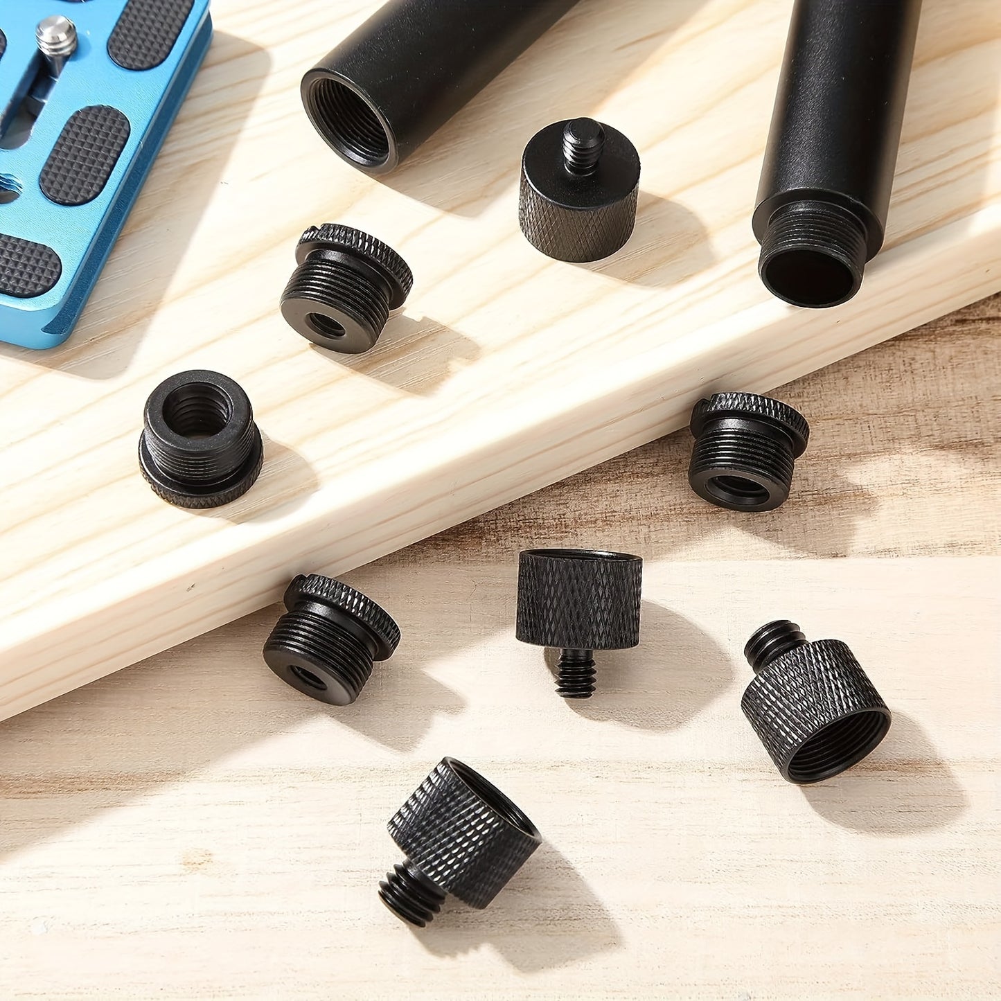 Set of 8 mic stand adapter pieces, featuring various female to male thread sizes for microphone compatibility.